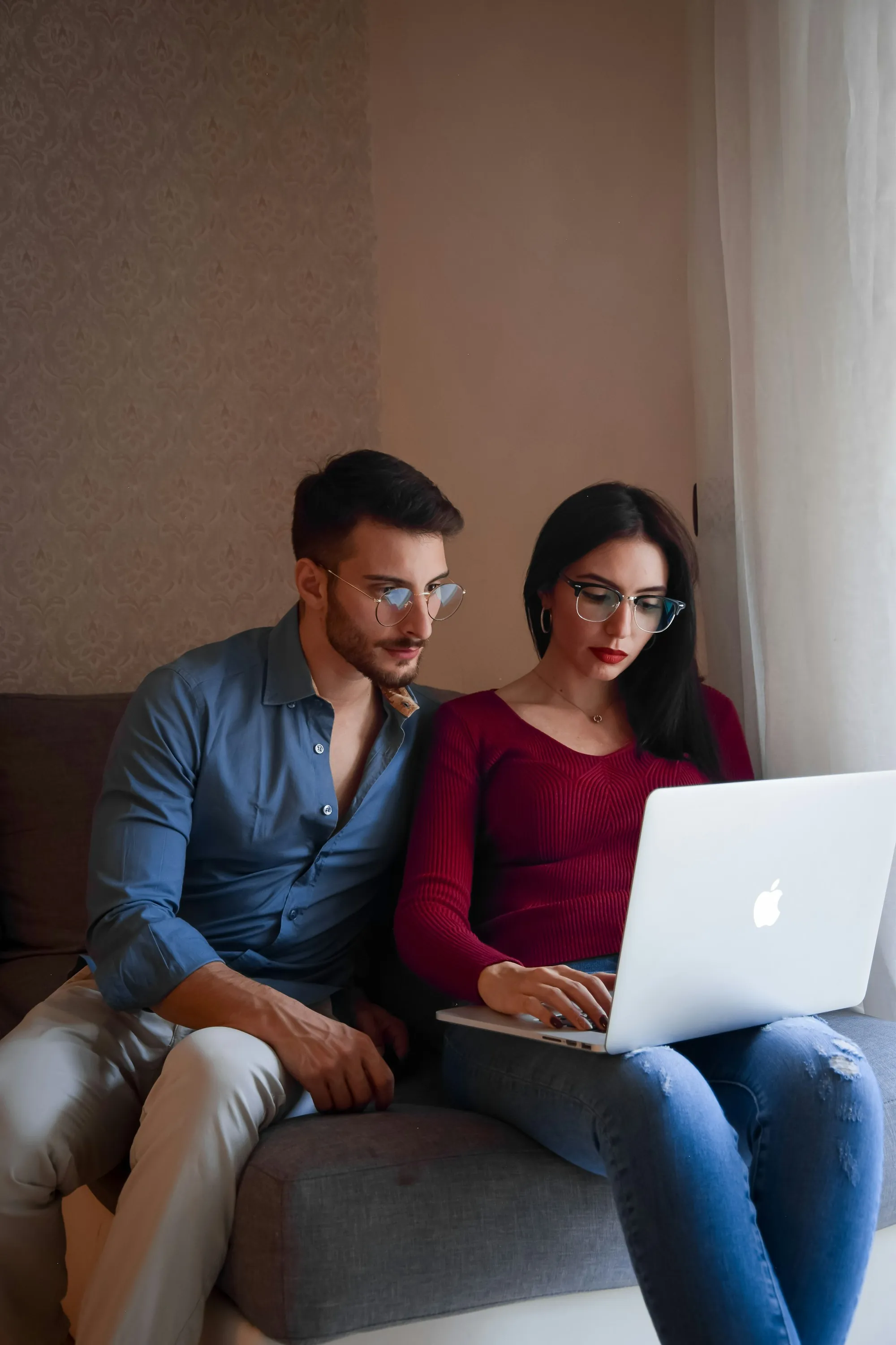 Couple reviewing information on a laptop