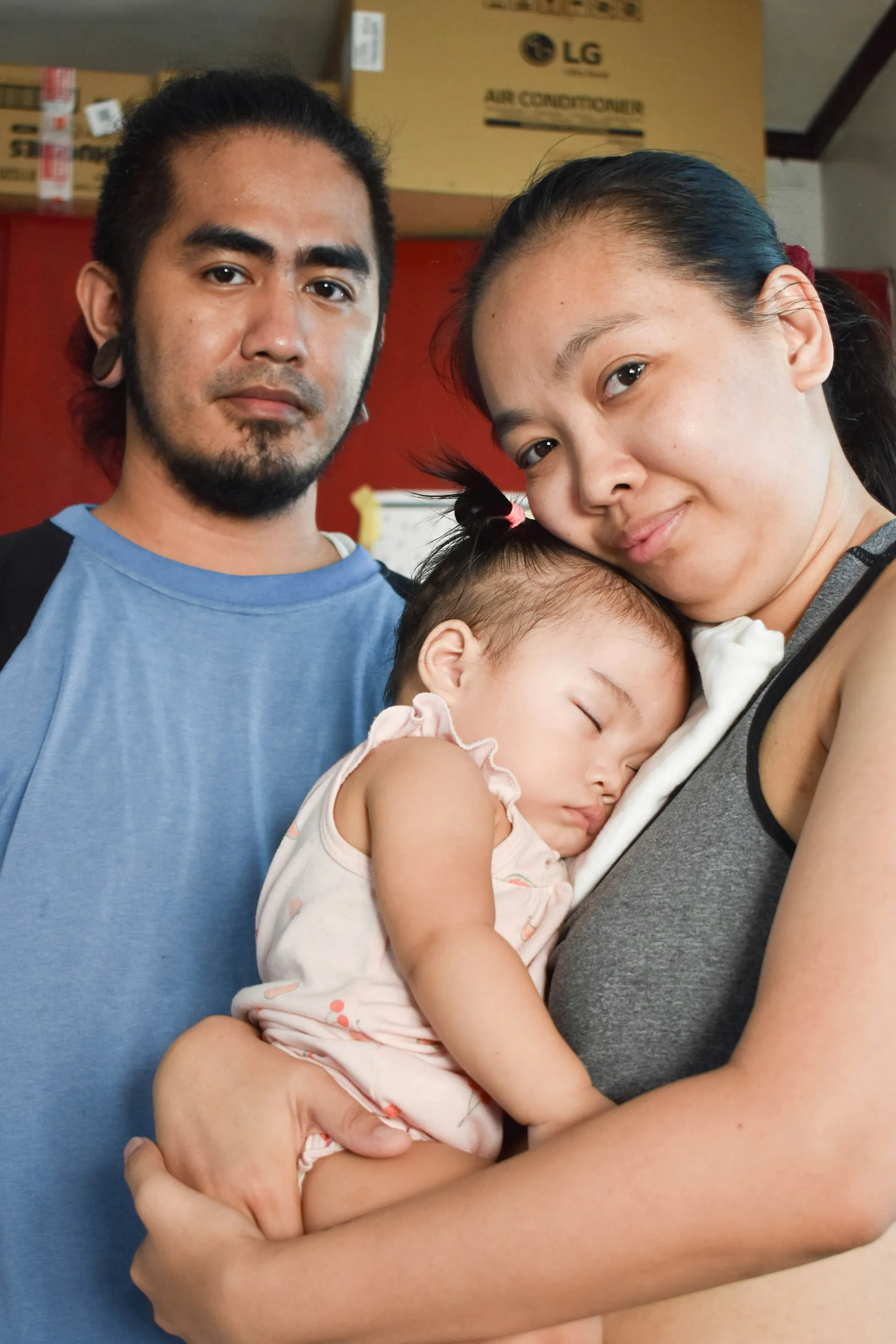 Baby asleep on a parent's chest
